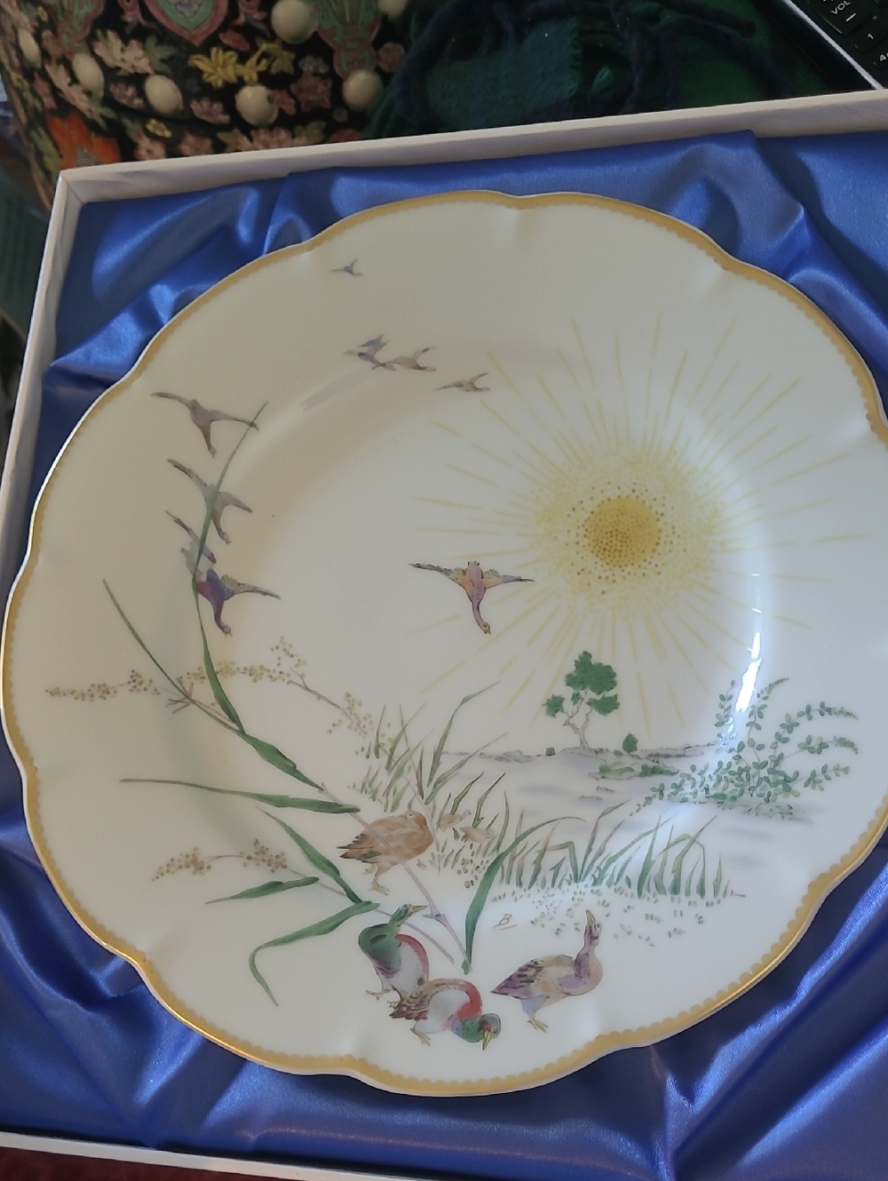 Fine Porcelain Decorative Plate with Sun and Wildlife Motif - White and Gold